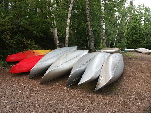 Canoes wait along Sawbill Lake