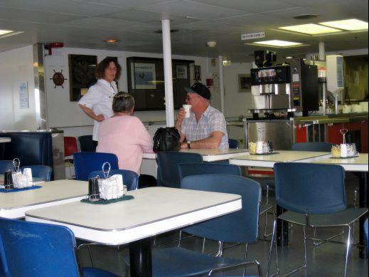06-pr-k-taku-helpful-crew.jpg - As soon as folks claimed their space on the ferry, most headed to the cafeteria for dinner.  The food wasn’t great but it was reasonable and plentiful.  Many of us hung around to chat with each other and with crew members.  They had lots of information and insight to give.