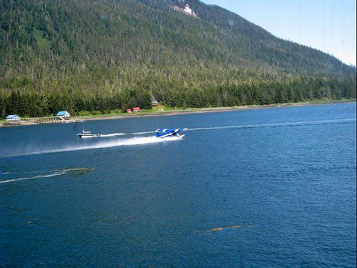 13-fairweather-float_plane_petersburg.jpg - While waiting for Fairweather to leave the dock, a floatplane took off right next to us.  Floatplanes are a common sight and an important means of getting around.  They are used to deliver mail and supplies, as well as passenger, to locations all over Alaska.  It is initially strange to us, seeing floatplanes tied up at docks lining the shoreline but it was a common sight throughout Alaska.
