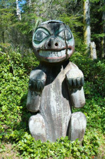 pow-haida-totem.jpg - Totem poles are an important part of the Haida people’s culture.  And not all totem poles are a towering creation.  This bear totem, commemorating someone’s life, was just outside the Long House in Kasaan, AK and only about six feet tall.