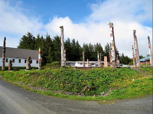 09-totem-park-hydaburg.jpg - Hydaburg was a “Native People” community where descents from the original Sukkwan, Howkan and Klinkwan Haida people live.  The totems seen in this photograph are restored and replicated totems brought in from traditional Haida villages that were located in southern Prince of Wales Island.  Totem poles are something like history, story, or text books.  Unfortunately, just what some of these “books” say has been lost but efforts continue to retain what is left.